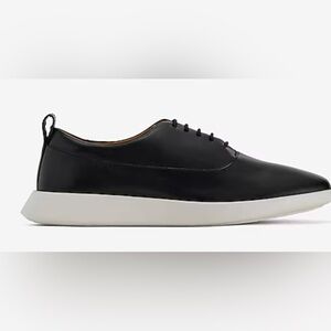 NWT men’s black lace up shoes with a white soul. Made with real leather size 10.